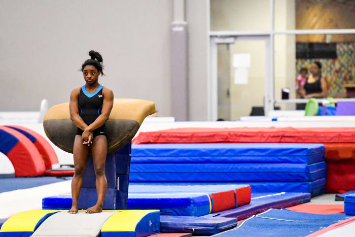 Biles would ordinarily be training at her gym in Spring, Texas, but is instead stuck at home, where she's socially distancing with just her dog, Lilo.